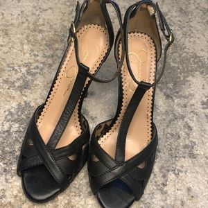 T-strap peep toe heels.